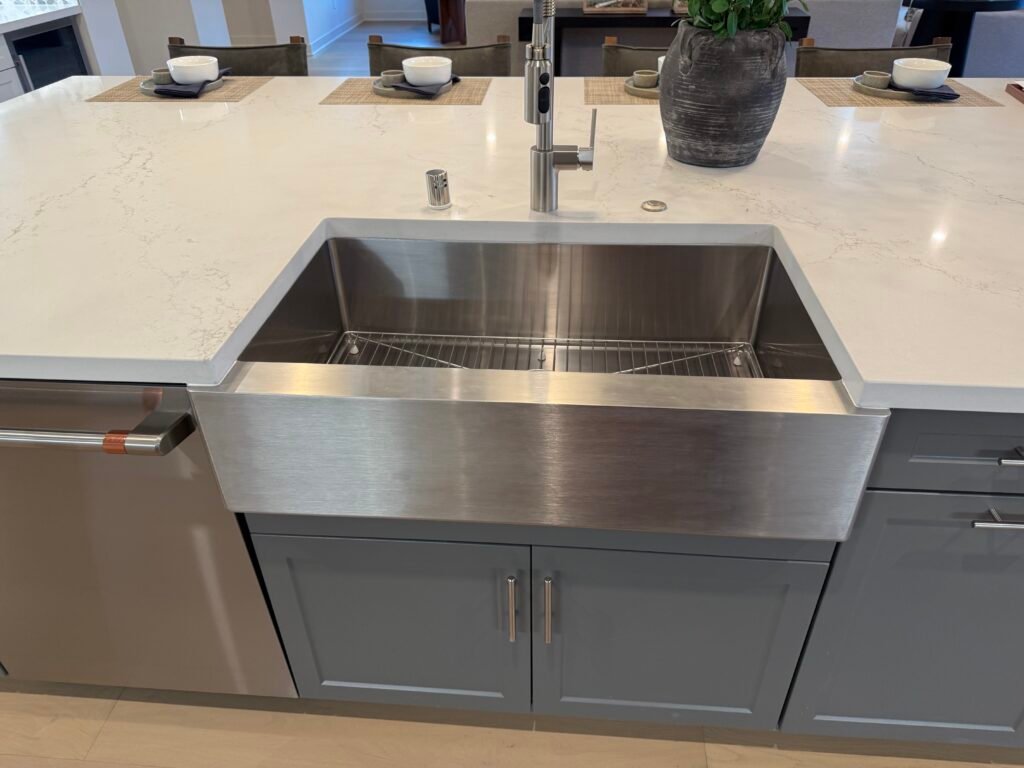 New kitchen remodel with cabinets, quartz countertop, stainless steel farmhouse sink and faucet built into Island. Rancho Bernardo Poway Scripps Ranch Rancho Santa Fe Fairbanks Ranch