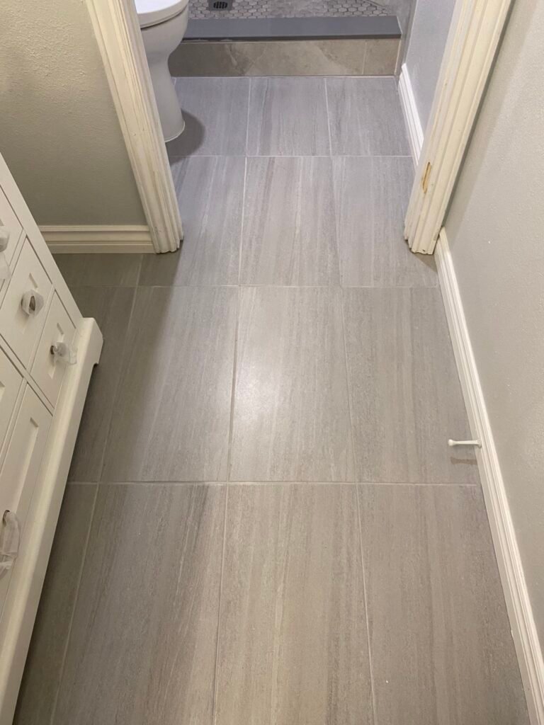 Beautiful bathroom flooring tile cut with precision and built on hardibacker subfloor